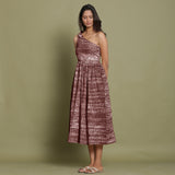 Left View of a Model wearing Maroon Shibori One-Shoulder Midi Dress