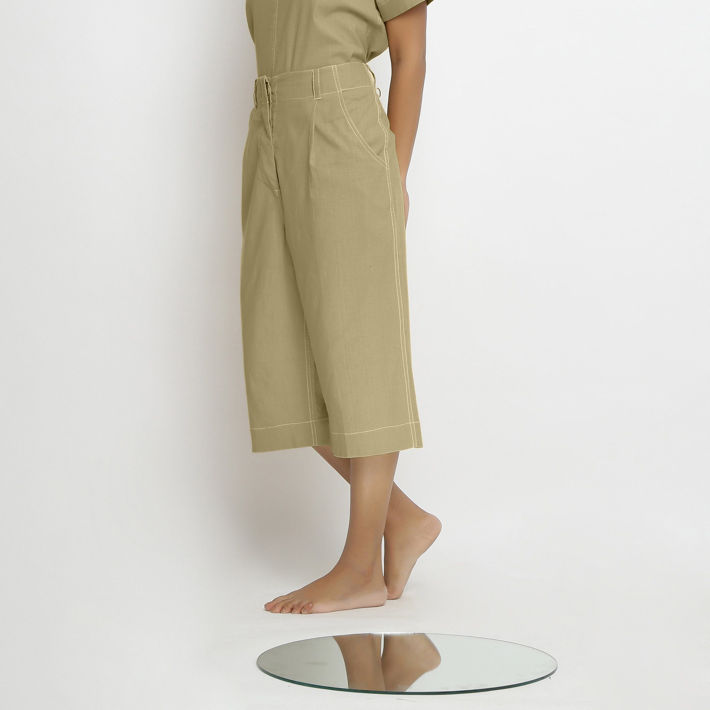 Left View of a Model wearing Mid-Rise Green Vegetable Dyed Cotton Culottes