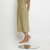 Left View of a Model wearing Mid-Rise Green Vegetable Dyed Cotton Culottes