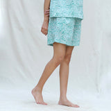 Right View of a Model wearing Mint Green Floral Block Printed Cotton High-Rise Elasticated Shorts