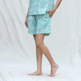 Left View of a Model wearing Mint Green Floral Block Printed Cotton High-Rise Elasticated Shorts