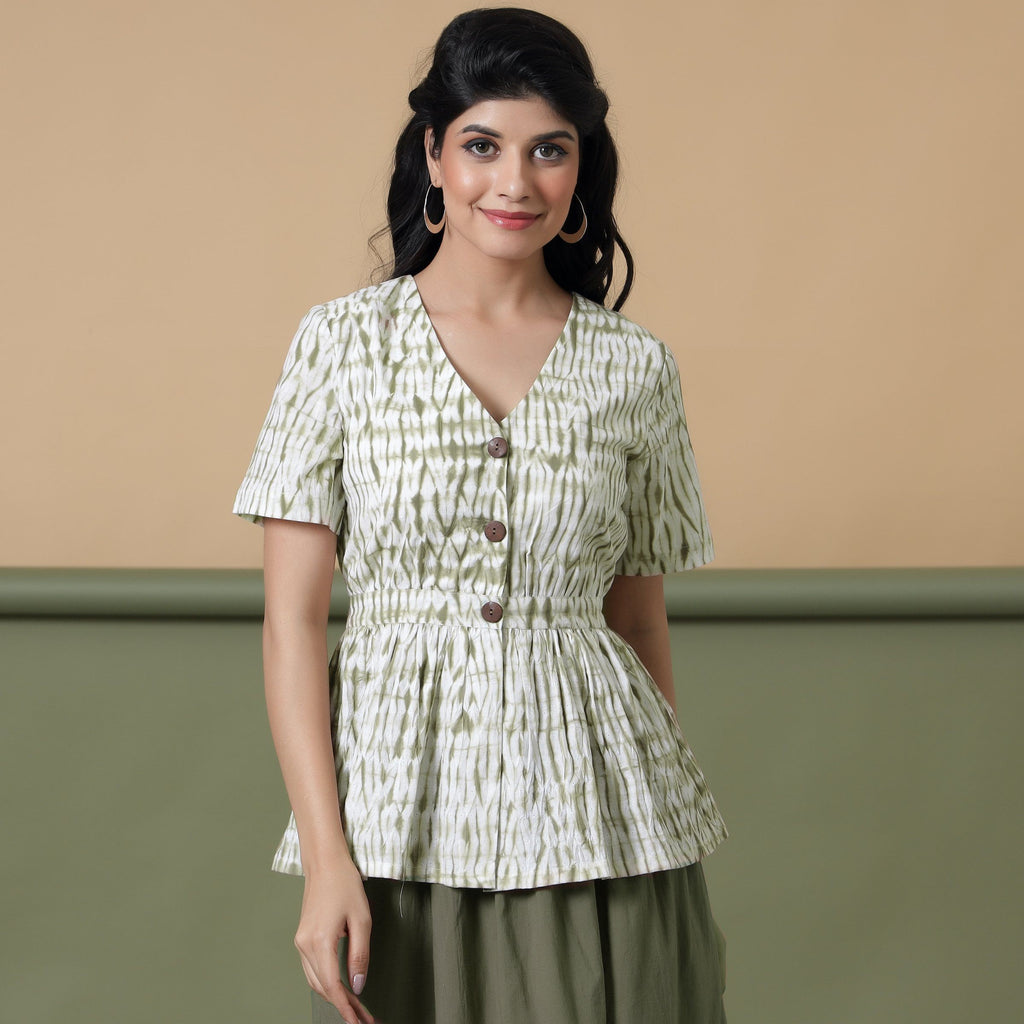 Front View of a Model wearing Moss Green Shibori Peplum Top