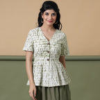 Front View of a Model wearing Moss Green Shibori Peplum Top