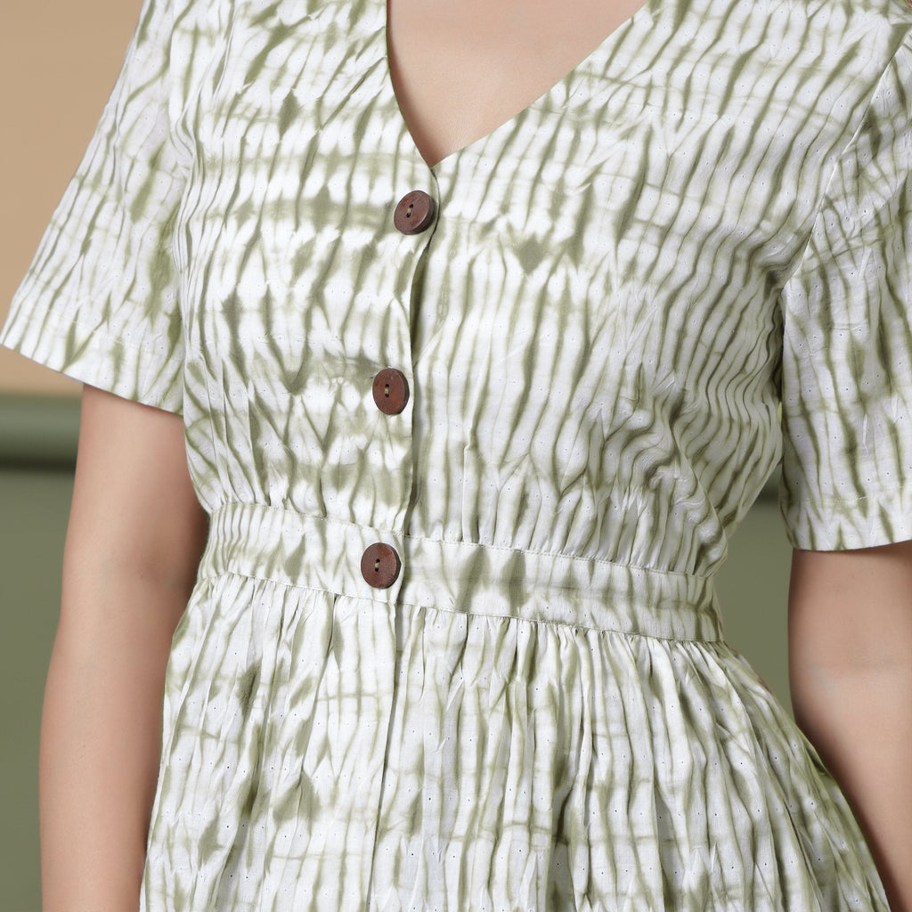 Front Detail of a Model wearing Moss Green Shibori Peplum Top