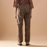 Back View of a Model wearing Warm Muddy Green Kalamkari Straight Pants