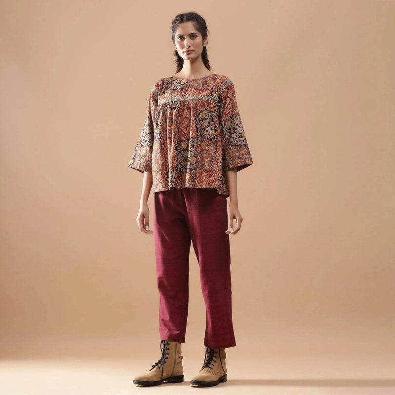 Front View of a Model wearing Muddy Red Block Print Cotton Kalamkari Top