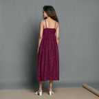 Back View of a Model wearing Mulberry Handspun Cotton Strappy Midi Gathered Dress
