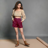 Front View of a Model wearing Mulberry Handspun Cotton High-Rise Elasticated Shorts