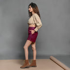Left View of a Model wearing Mulberry Handspun Cotton High-Rise Elasticated Shorts