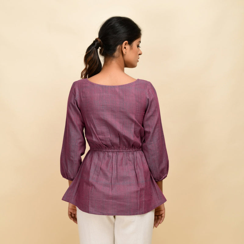 Back View of a Model wearing Mulberry Yarn Dyed Handspun Cotton Round Neck Peplum Top