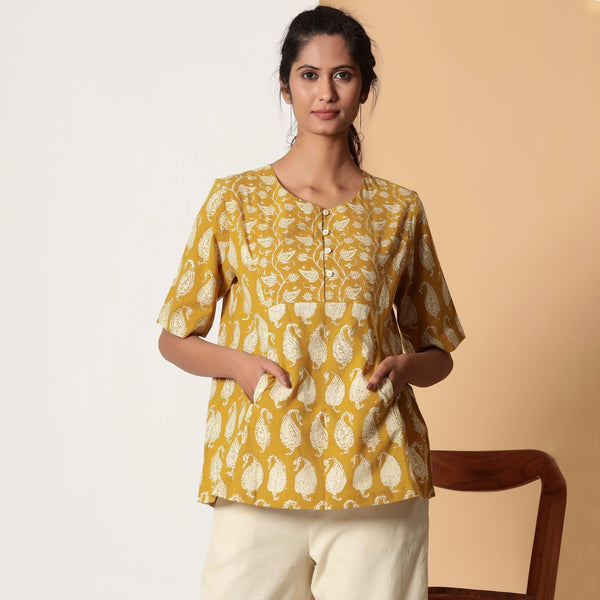 Front View of a Model wearing Mustard Bagru Block Printed Pocket Top