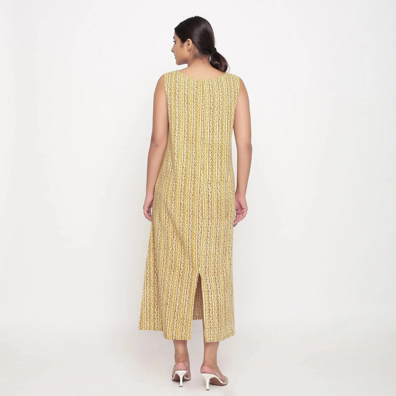 Back View of a Model wearing Mustard Block Print Cotton Shift Maxi Dress