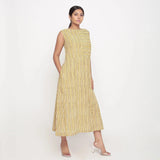 Right View of a Model wearing Mustard Block Print Cotton Shift Maxi Dress