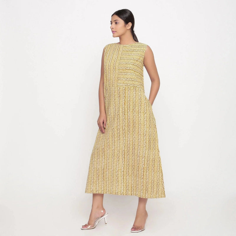 Left View of a Model wearing Mustard Block Print Cotton Shift Maxi Dress