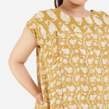 Front Detail of a Model wearing Mustard Block Printed Cotton Knee Length Yoke Dress