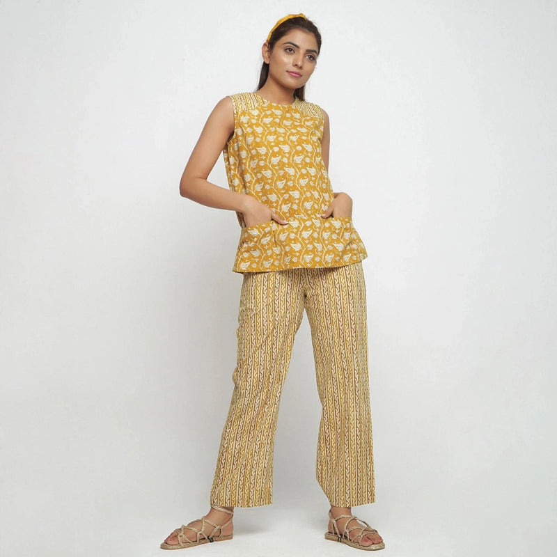 Front View of a Model wearing Mustard Bagru Block Printed Yoked Top