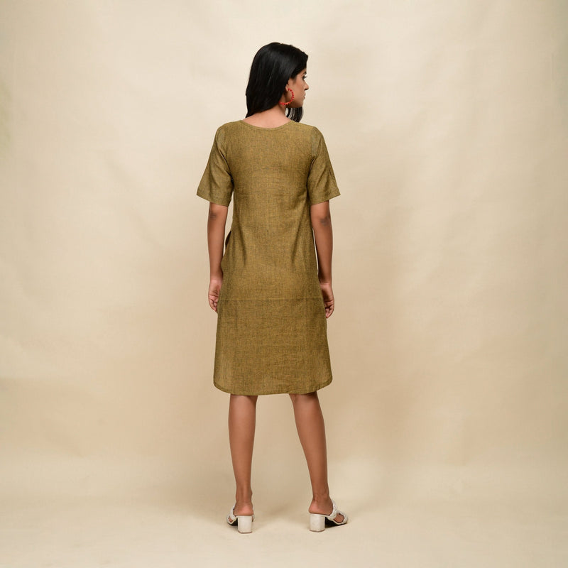 Back View of a Model wearing Mustard Gold 100% Cotton Knee Length Dress