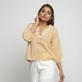 Front View of a Model wearing Mustard Ditsy Block Printed Cotton Straight Top