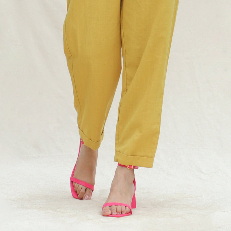 Close View of a Model wearing Mustard Handspun Cotton High-Rise Elasticated Paperbag Pant