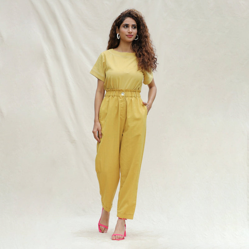 Front View of a Model wearing Mustard Handspun Cotton High-Rise Elasticated Paperbag Pant