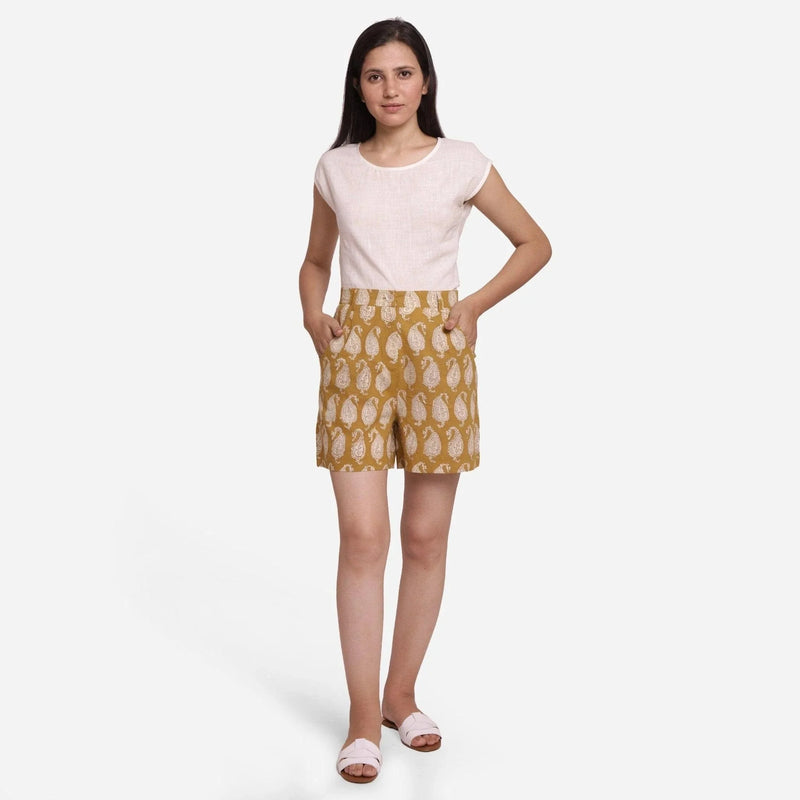 Front View of a Model wearing Mustard Paisley Block Print Cotton Shorts