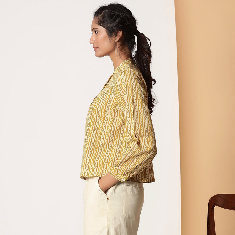 Left View of a Model wearing Mustard Striped Bagru Block Print Yoked Shirt