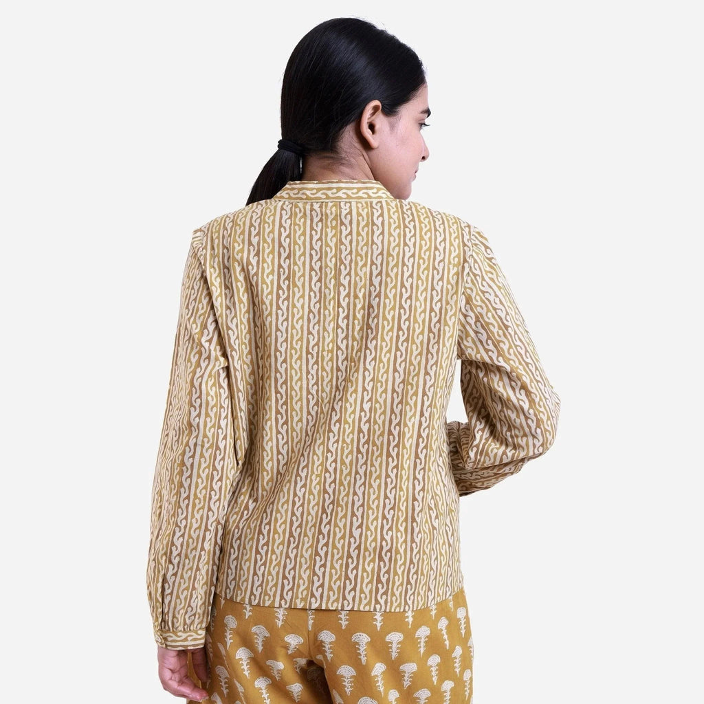 Back View of a Model wearing Mustard Striped Block Print Cotton Mandarin Collar Top