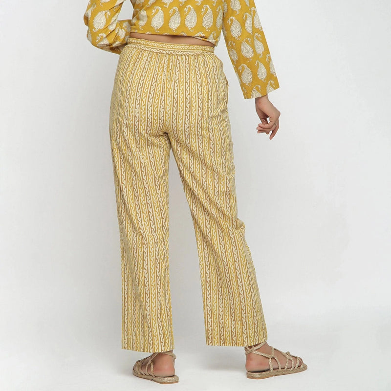 Back View of a Model wearing Mustard Bagru Block Print Straight Pant