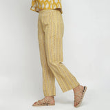 Left View of a Model wearing Mustard Bagru Block Print Straight Pant