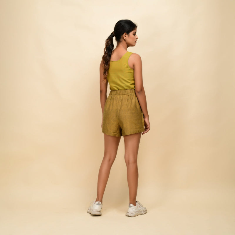 Back View of a Model wearing Mustard Gold 100% Cotton Short Shorts
