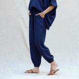 Left View of a Model wearing Navy Blue Cotton Flax High-Rise Elasticated Jogger Pant
