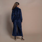 Back View of a Model wearing Navy Blue Cotton Velvet Bootcut Jumpsuit