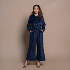 Front View of a Model wearing Navy Blue Cotton Velvet Bootcut Jumpsuit