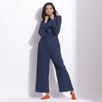 Front View of a Model wearing Navy Blue Cotton Waffle Turtle Neck Overalls