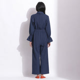 Back View of a Model wearing Navy Blue Cotton Waffle Turtle Neck Overalls