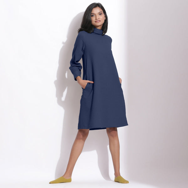 Front View of a Model wearing Navy Blue Cotton Waffle Turtleneck Dress