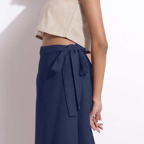 Left Detail of a Model wearing Navy Blue Cotton Waffle Wrap Skirt