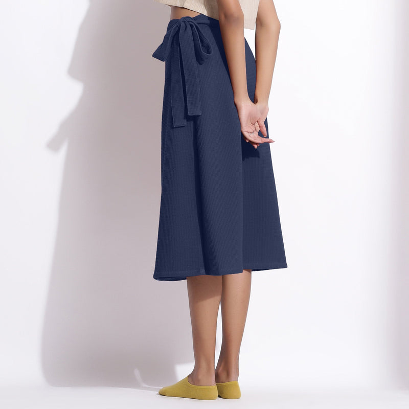 Back View of a Model wearing Navy Blue Cotton Waffle Wrap Skirt