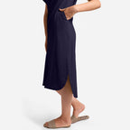 Left Detail of a Model wearing Navy Blue Cotton Welt Pocket Shift Dress