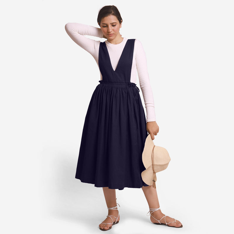 Front View of a Model wearing Navy Blue Deep Neck Pinafore Midi Wrap Dress