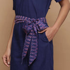 Left Detail of a Model wearing Navy Blue Handspun Ikat Straight Jumpsuit