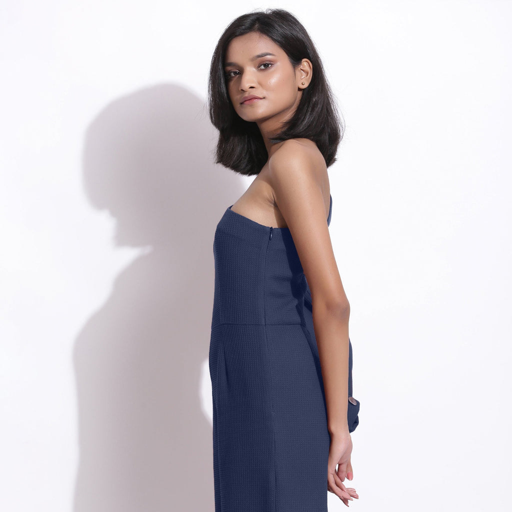 Left View of a Model wearing Navy Blue Honeycomb One-Shoulder Jumpsuit