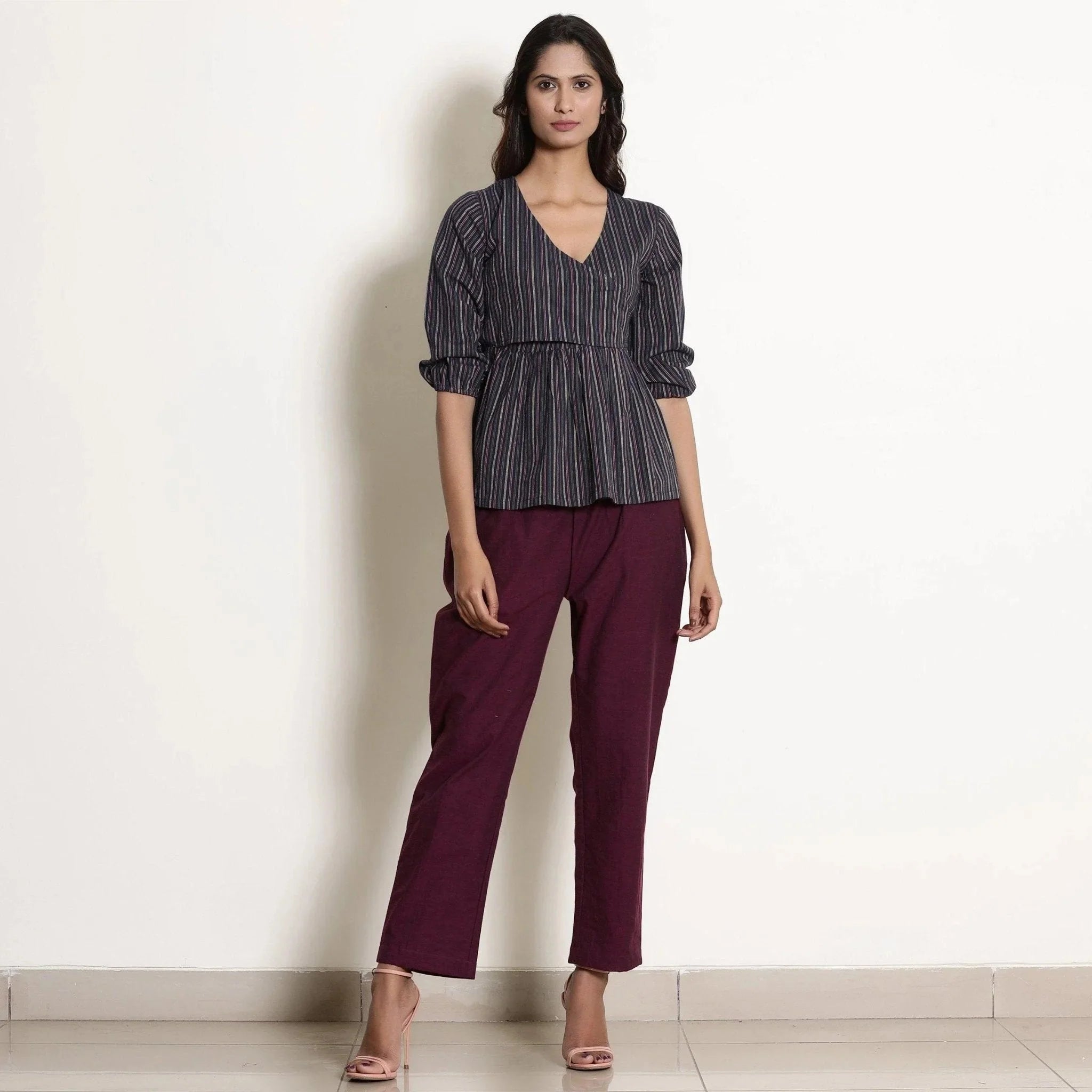 Front View of a Model wearing Navy Blue Striped Back Tie Up Wrap Top