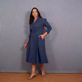 Left View of a Model wearing Navy Blue Warm Cotton Waffle Pleated Button-Down Midi Dress