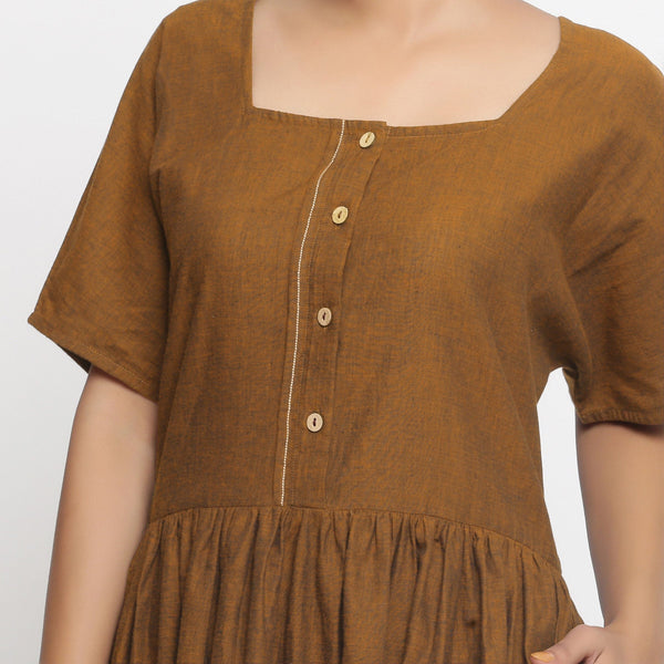 Front Detail of a Model wearing Oak Brown Cotton Button-Down Gathered Dress