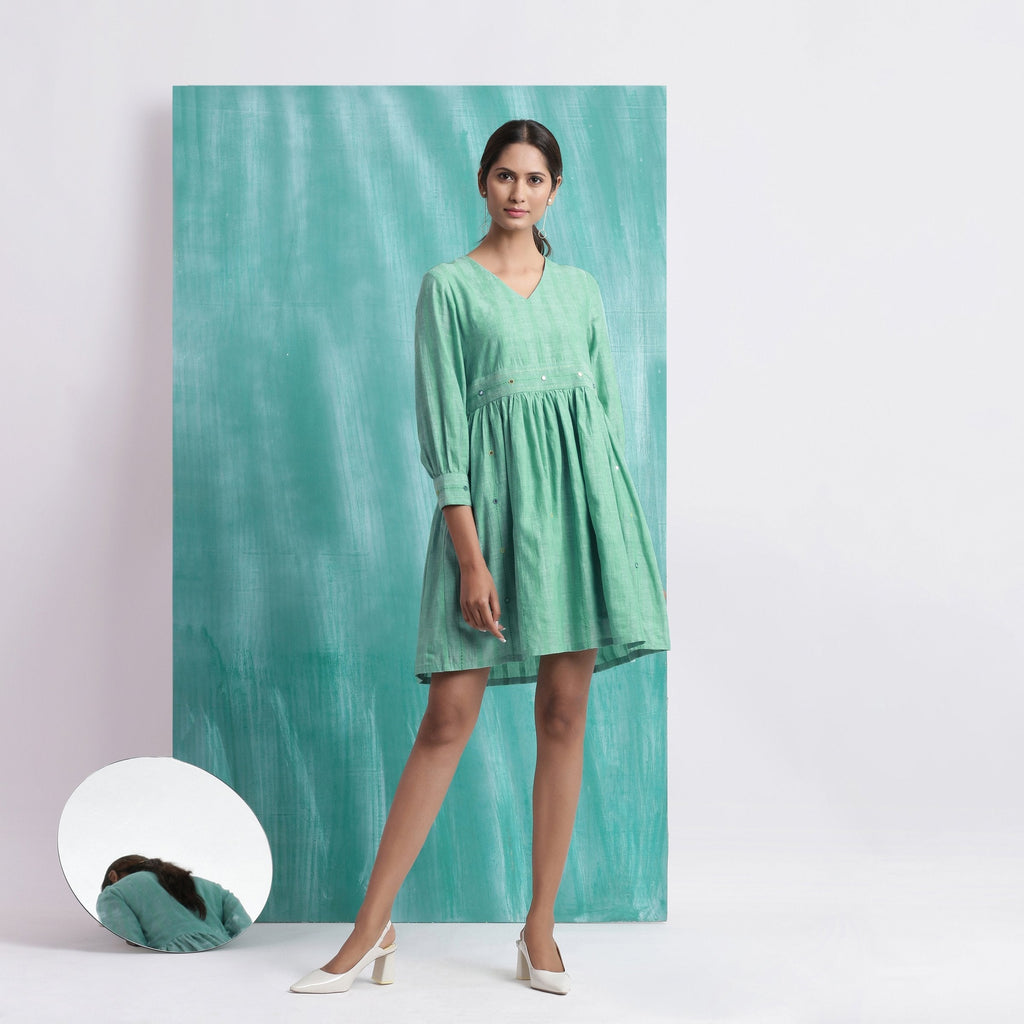 Front View of a Model wearing Ocean Green Handspun Cotton V-Neck Gathered Short Dress