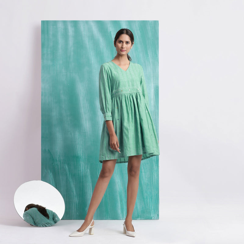 Front View of a Model wearing Ocean Green Handspun Cotton V-Neck Gathered Short Dress