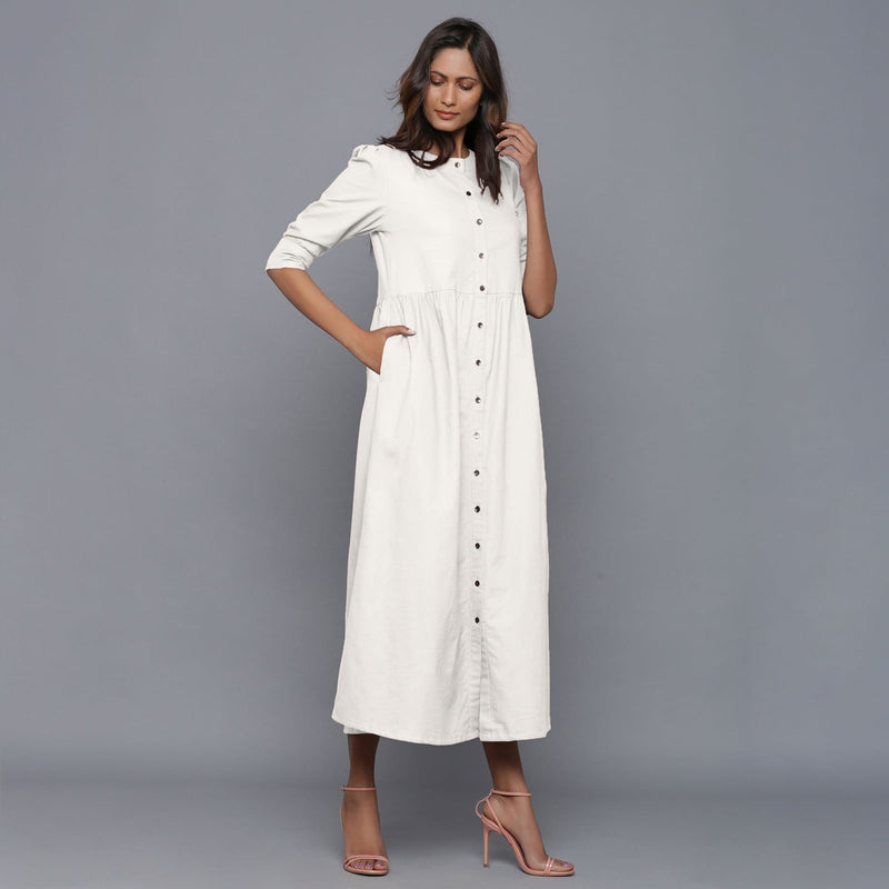 Right View of a Model wearing Off-White Cotton Flannel Gathered Dress