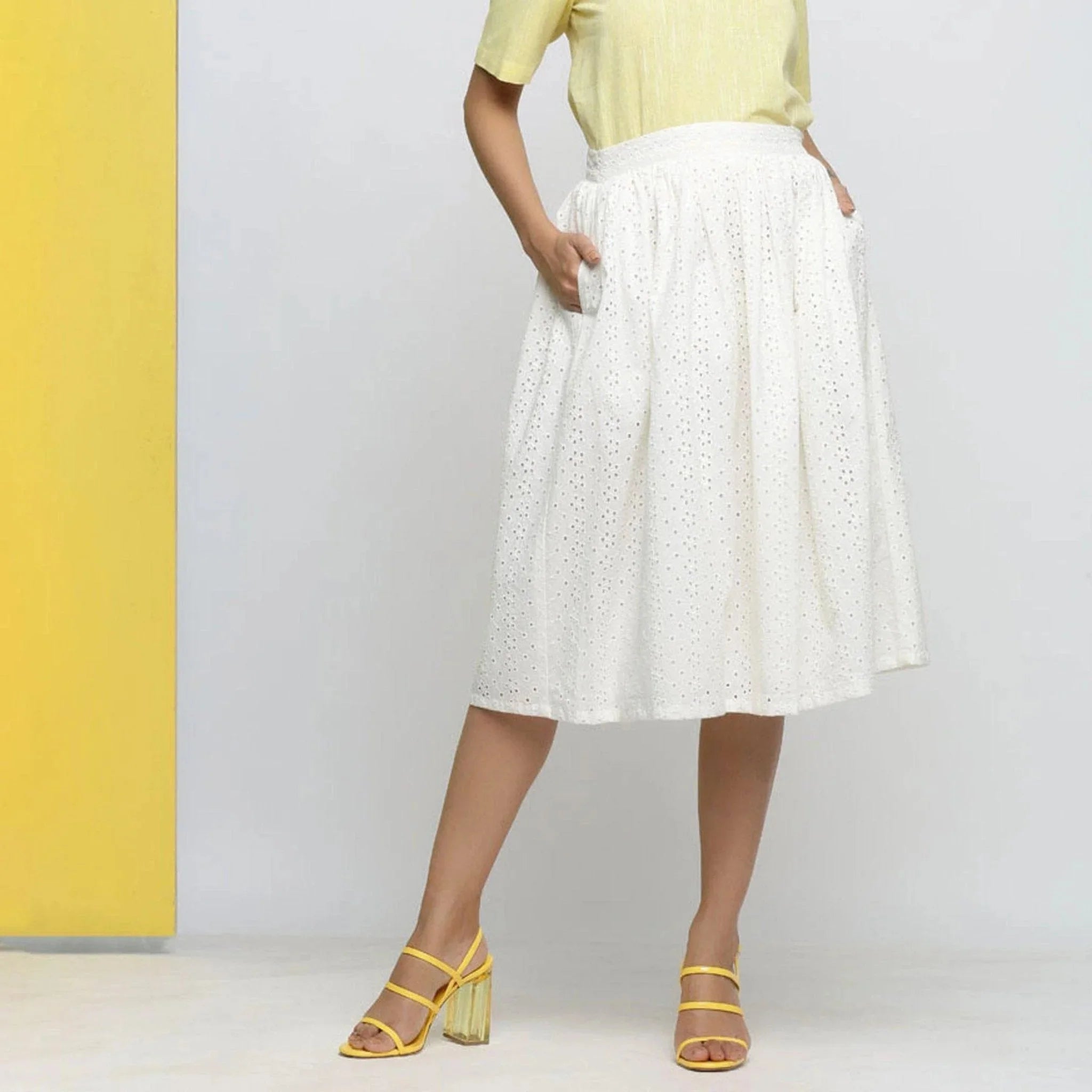 Front View of a Model wearing Off-White Cotton Schiffli Gathered Skirt