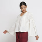 Left View of a Model wearing Off-White Cotton Slub Solid V-Neck Top